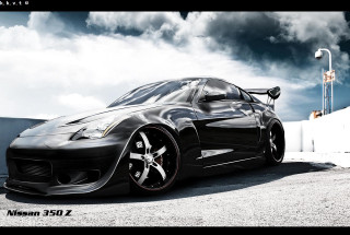 Black sports car cloudy sky 12 - a white fence free wallpaper