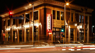 Building corner sign nighttime car - arthouse free wallpaper