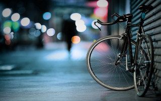 Bicycle wall city night blurry - a bicycle free wallpaper for desktop
