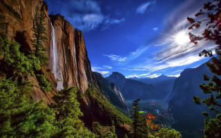 Waterfall mountain forest distant scenery - a waterfall free wallpaper