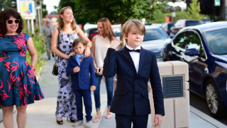 Young boy tuxedo bowtie walking - a sidewalk free wallpaper