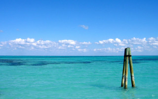 Wooden pole ocean sky clouds - the ocean water free wallpaper