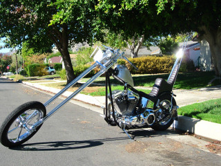 Motorcycle parked road tree sidewalk - a surrealist sculpture free wallpaper