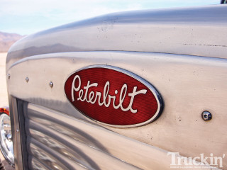 Car red emblem sidewindow desert - a close up of a car free wallpaper