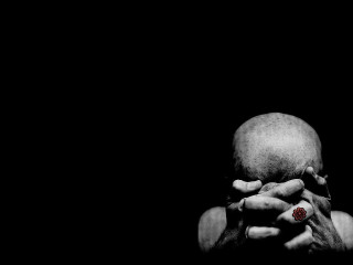 Person holding red object dark - their hands in free wallpaper