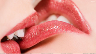 Woman lips bite white background 2 - a bite free wallpaper