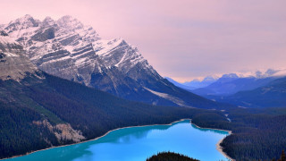 Mountain range lake snow capped 2 - a lake in the middle of it free wallpaper