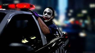 Clown mask man policecar night - movie scene free wallpaper