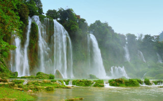 Waterfall man river boat nature - a river below free wallpaper