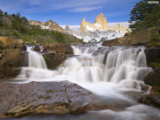 Waterfall mountain blue sky clouds 2 - a few snow free wallpaper