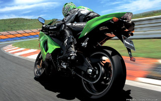 Person riding green motorcycle track - a green motorcycle free wallpaper