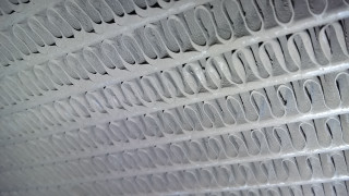 Close up wall pattern circles - a close up of a wall free wallpaper