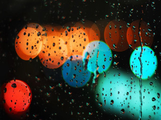Rain covered window lights background - a close up of a rain free wallpaper