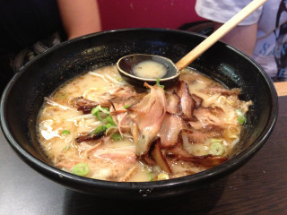 Soup bowl meat vegetables spoon - a woman in the background free wallpaper