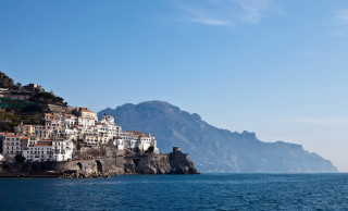 Village cliff ocean mountains boat - the background and a boat free wallpaper