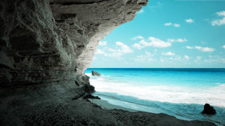 Person rock ocean cliff blue 3 - exekia free wallpaper for desktop
