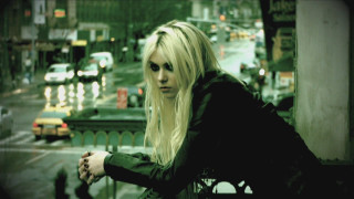 Blonde woman balcony city night - traffic free wallpaper