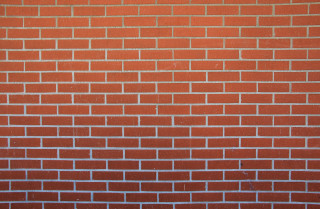 Red brick wall white clock 7 - a red brick wall free wallpaper