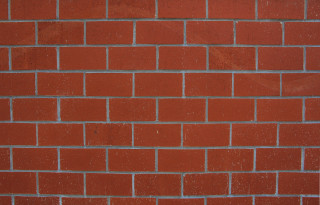 Red brick wall white clock 5 - a red brick wall free wallpaper