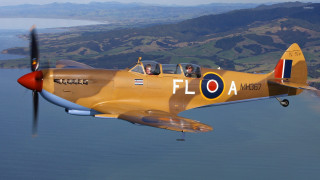 Yellow airplane flying water propeller - side and a propeller free wallpaper