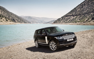 Black land rover lake mountains - the background and a body of water free wallpaper