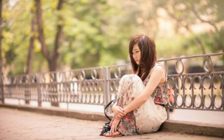Woman sitting sidewalk shoes hand - her knee free wallpaper