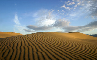 Sand dune sky clouds background - a large sand dune free wallpaper