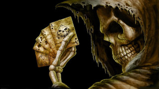 Skeleton holding deck of cards - a skeleton holding free wallpaper