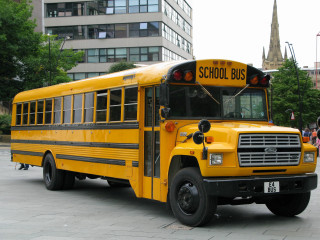 School bus parking lot people - front view free wallpaper