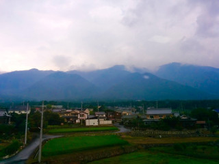 Village mountains cloudy sky background - murata range free wallpaper