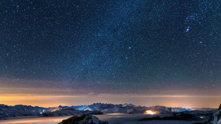 Night sky mountains bright light - a bright light in the distance free wallpaper