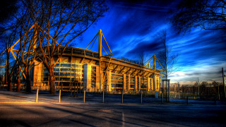 Stadium fence trees sunset blue - a stadium free wallpaper
