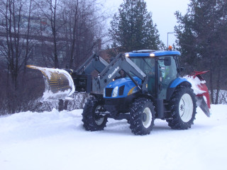 Tractor plowing snow field snow - a tractor free wallpaper