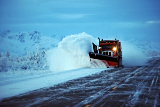 Large truck plowing snow covered - road free wallpaper