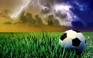 Soccer ball grass storm cloud 2 - thunderstorm free wallpaper