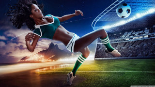 Woman kicking soccer ball grass - a stadium free wallpaper for desktop