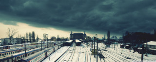 Train station dark sky clouds - a train station free wallpaper