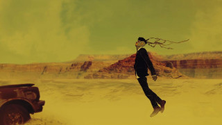 Man black suit jumping car - dan smith free wallpaper