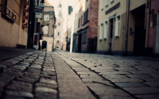 Person walking city street buildings - a street in a city free wallpaper