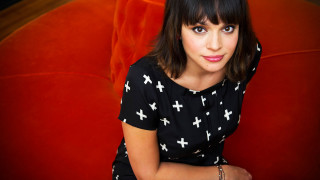 Woman sitting red chair arms 2 - a red chair free wallpaper