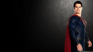 Man superman costume black background 2 - heroic pose free wallpaper