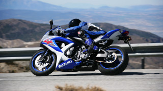 Motorcycle ride mountains hills background - motion blur free wallpaper