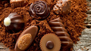 Chocolates dirt wooden table candle 3 - decadent free wallpaper