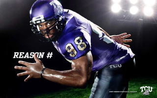 Football player purple uniform hands - his hands out free wallpaper