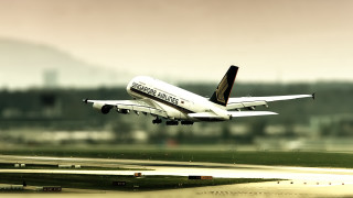 Large passenger jet flying runway 2 - a large passenger free wallpaper