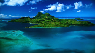 Small island water clouds plane - a small island free wallpaper