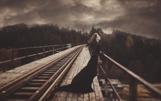 Woman black dress bridge train - a train track in the background free wallpaper