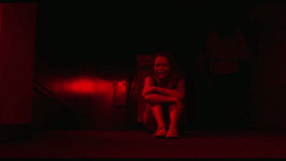 Woman sitting dark room red - symbolism free wallpaper