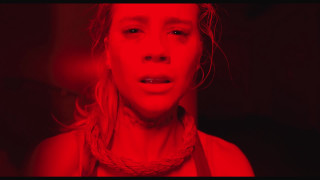 Woman red light dark background - a red background behind her free wallpaper