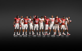 Football players standing line helmets - helmet free wallpaper
